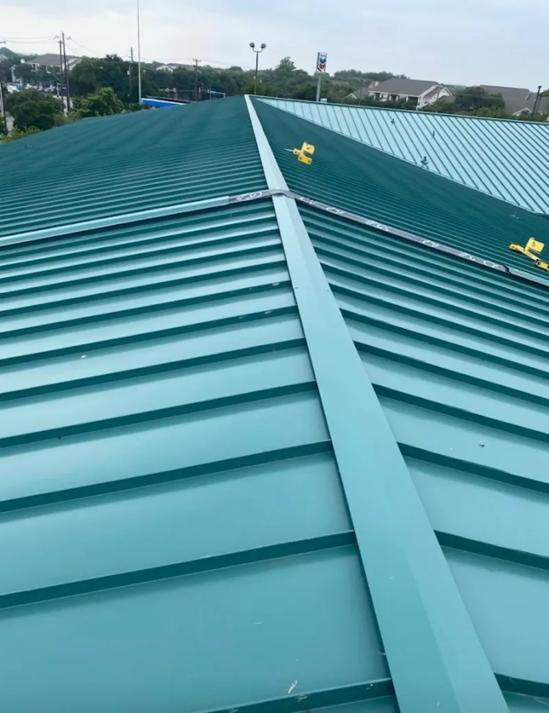 Green commercial metal roof ridge and valley for Metal Roof Repair in Welcome